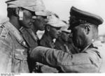 Erwin Rommel awarding the Iron Cross to a man under his command, North Africa, Aug 1942