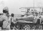 Erwin Rommel speaking to soldiers from his SdKfz. 250/3 vehicle 