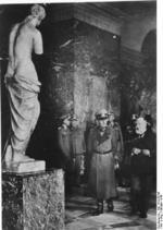 Curator of the Louvre Fernand Merlin giving German Field Marshal Gerd von Rundstedt a tour of the museum, Paris, France, Oct 1940; note Venus de Milo status in foreground