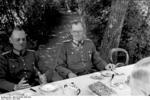 German Army Generals Gerd von Rundstedt and Maximilian von Weichs having a meal with other officers in a garden, France, Jun 1940
