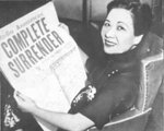 Song Meiling posing with a newspaper headlining Japan