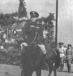 Sun Li-jen on horseback, China, circa 1940s; note Chinese New 1st Army banner in background