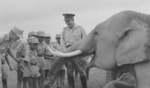 Sun Li-jen with children of subordinates, playing with an elephant, India, 1940s