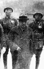 Hisao Tani being escorted by Chinese soldiers during his war crimes trial in Nanjing, China, 1947