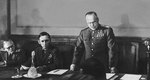 Georgy Zhukov reading the act of the German surrender, with Arthur Tedder seated next to him, Berlin, 8 May 1945
