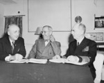 US Secretary of State James Byrnes, President Harry Truman, and Admiral William Leahy meeting aboard USS Augusta, 12 Jul 1945