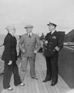 US President Harry Truman, Secretary of State James Byrnes, and Captain James Foskett aboard USS Augusta, 11 Jul 1945, photo 2 of 2