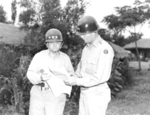 Lieutenant General Walton Walker and Major General William Dean studying a map near Taejon, Korea, 8 Jul 1950