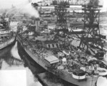 USS Alabama at Norfolk Naval Shipyard, Portsmouth, Virginia, United States, Feb-Aug 1942; note Crane Ship No. 1, former battleship Kearsage, servicing Alabama