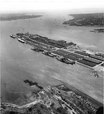 Alaska, Guam, North Carolina, Washington, Enterprise, Franklin, and other ships at  Bayonne Naval Supply Depot, New Jersey, United States, 15 Apr 1953