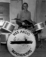 AMM 3rd Class L. H. McDowell at the drums during an orchestra performance aboard USS Anzio, 18 Feb 1945
