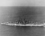 USS Astoria underway en route to Philadelphia Naval Shipyard, 22 Jul 1944; note camouflage Measure 33 Design 24d