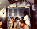 Lieutenant David McClintock, Commander David White, and Lieutenant Charles Nace dining in the wardroom aboard USS Cero while the submarine was at Groton, Connecticut, United States, Jul-Aug 1943