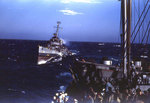 Destroyer Cotten steaming at sea, circa 1945, photo 5 of 7; men of APA Sanborn in foreground