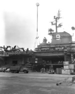 USS Essex docked at Yokosuka, Japan, 29 Sep 1951; note CCKW truck on pier and AFKWX truck on crane