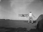 Flight deck signal officer directing the landing of an Albacore aircraft of No. 820 Squadron FAA aboard HMS Formidable, 1940s