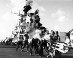 Crewmen of USS Hancock preparing FFAR rockets for an aircraft strike against Japanese positions on Taiwan island, 12 Oct 1944. The Hancock air group fired 176 rockets on this date.