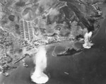 Carrier aircraft of US 3rd Fleet planes attacking battleship Haruna, Kure, Japan 28 Jul 1945; photo taken by aircraft from USS Intrepid