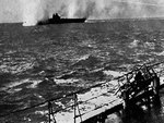 HMS Illustrious under Stuka dive bomber attack in the Mediterranean Sea near Malta, 10 Jan 1941