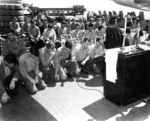 The Catholic chaplain aboard battleship Indiana serving communion on the ship