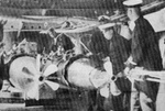 Loading torpedoes into the port-side tubes of cruiser Ninghai, 1930s