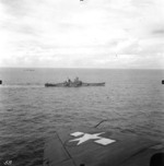 Battleships Iowa and Indiana underway during the Marshall Islands Campaign, 24 Jan 1944; note ships with Camouflage Measure 32 Design 1B and wing of SB2C Helldiver aircraft in foreground