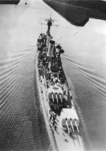 German light cruiser Köln underway in confined waters, circa 1930, photo 1 of 2; note off-centerline positioning of turrets