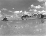 LST-1 (right) and LST-292 high and dry on the beach at Saint-Michel-en-Greves in the Brittany region of France, Sep 1944