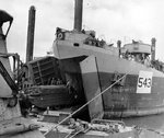 DUKW loaded with supplies for supplying the Normandy beachhead boarding LST-543, England, United Kingdom, Jun 1944, photo 1 of 2