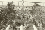 Line crossing ceremony aboard light cruiser USS Montpelier, circa 30 Dec 1942; note SOC-1 aircraft in background