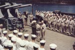 US Navy Rear Admiral Aaron S. Merrill receiving the Navy Cross award from Vice Admiral Aubrey W. Fitch on the after deck of USS Montpelier, Tulagi Harbor, Solomon Islands, 11 Dec 1943