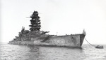 Battleship Nagato at Yokosuka, Japan, 1946; note heavily damaged superstructure and the American flag at bow