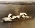 Battleship New Jersey firing a nine-gun salvo during bombardment operations against communist targets in Korea, adjacent to the 38th parallel, 10 Nov 1951
