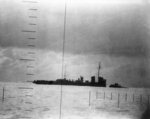 Japanese Patrol Boat #39 sinking after being torpedoed by American submarine Seawolf, 23 Apr 1943; seen from Seawolf