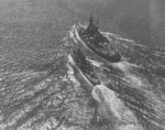 USS North Carolina and a destroyer-minelayer underway, 8 Oct 1944