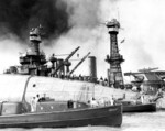 Men working on capsized USS Oklahoma at Pearl Harbor, Oahu, US Territory of Hawaii, 7 Dec 1941; note superstructure of USS Maryland in background