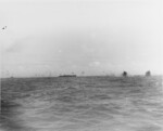 A Japanese aircraft crashing near USS Princeton off Taiwan, 14 Oct 1944