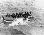 Princeton survivors jumping from a motorboat for USS Cassin Young, 24 Oct 1944