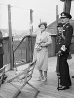 Queen Elizabeth and Vice Admiral J. A. G. Troup on the bridge of RMS Queen Mary on the River Clyde, Scotland, United Kingdom, 4 Jun 1942