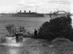 RMS Queen Mary in Sydney harbor between Bradleys Head and Sydney Harbour Bridge, Australia, 1940s