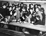 Off duty sailors in the mess hall aboard HMS Rodney, 1940-1941