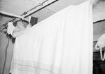A sailor in his bunk aboard HMS Rodney, 1940