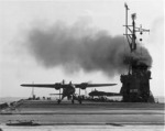 US Navy TDN-1 drone test from the decks of the training carrier USS Sable while steaming in reverse in Grand Traverse Bay, Michigan, United States, 10 Aug 1943. This particular test was unsuccessful. Photo 1 of 4.
