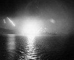USS Saint Paul bombarding communist positions at night near Hungnam, South Hamgyong Province, Korea, Dec 1950