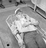 US Navy airmen Alva Parker, wounded during a raid on Rabaul in New Britain, aboard USS Saratoga awaiting medical treatment, 5 Nov 1943