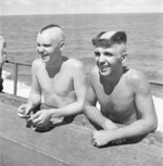 Sailors with unusual haircuts received during a Line Cross Ceremony aboard USS Saratoga, Mar 1944