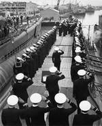 The National Ensign raised aboard submarine Skate, 15 Apr 1943; Seahorse at left & Sargo at right