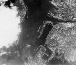 Aerial view of Kiel, Germany, Feb-Jun 1942, photo 1 of 2; note arrow in center marking position of battleship Scharnhorst; photograph probably taken by RAF personnel