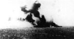 Shoho under attack, 7 May 1942; note the TBD-1 torpedo bomber visible against the smoke