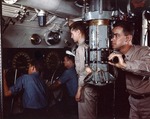 Commander of a US submarine sighting through a periscope during exercises at the Submarine Base, New London, Groton, Connecticut, United States, Aug 1943; either aboard Mackerel, Marlin, or Snook